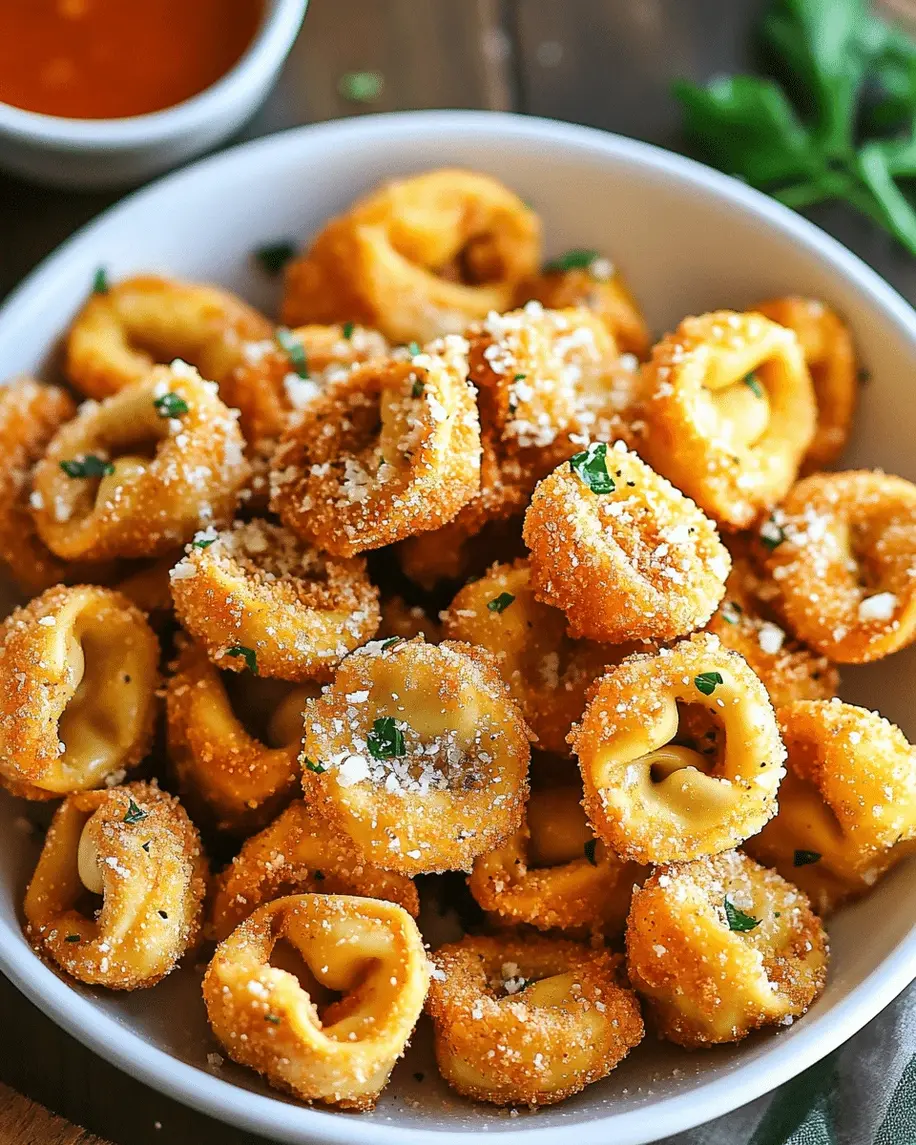 Golden brown crispy fried tortellini piled high with Parmesan and parsley.
