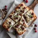 golden cottage cheese flatbread on rustic wooden cutting board