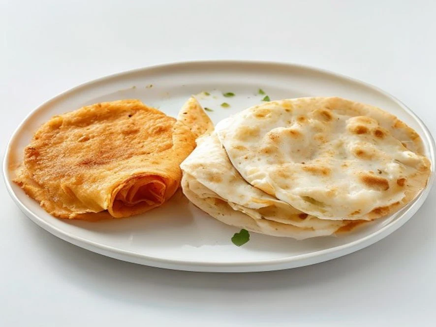 Three versions of Taco John's Mexi Rolls — deep fried golden, air fried lightly browned, and oven baked pale — on a white platter